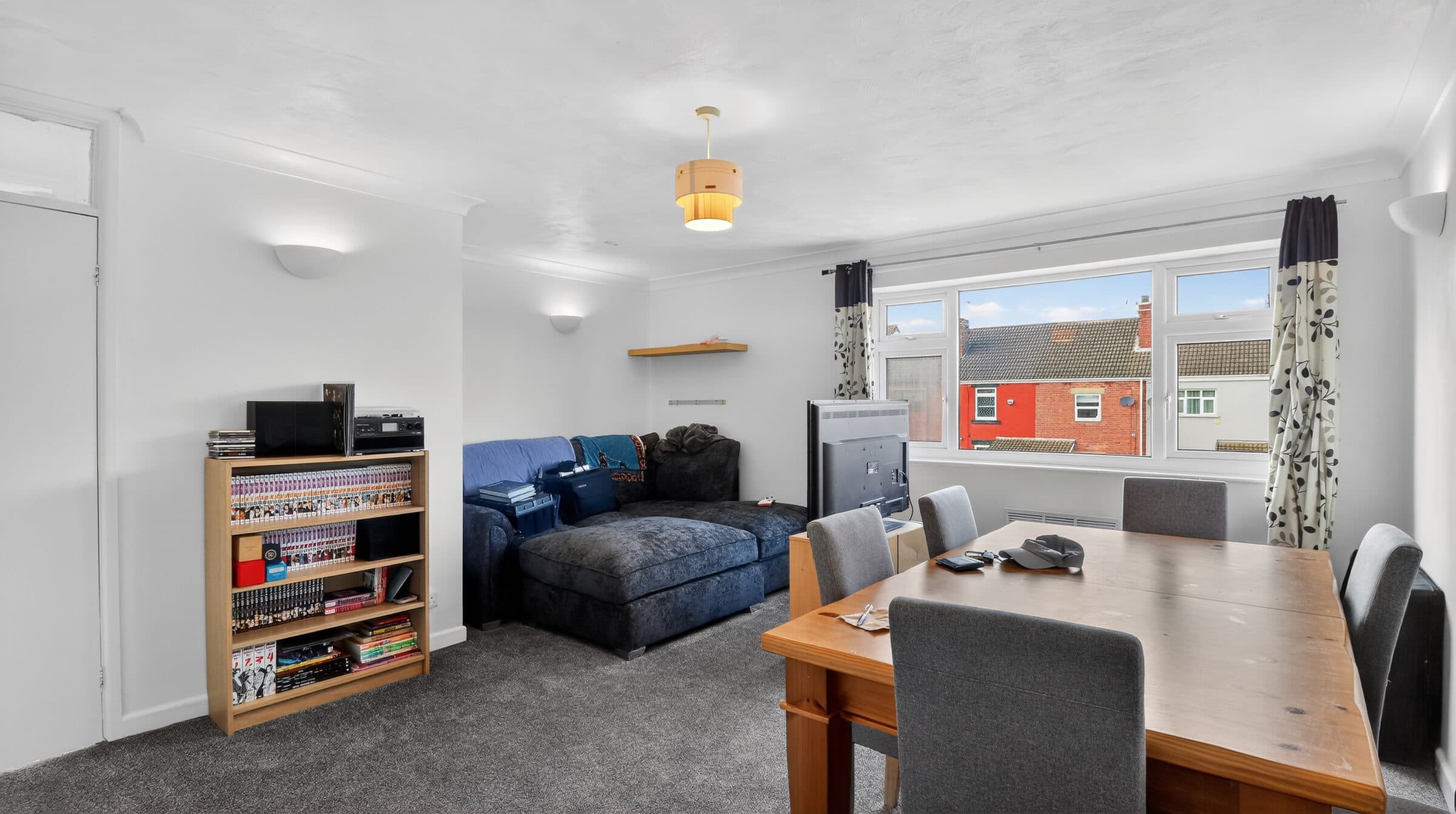 Professionally photographed, bright open-plan living and dining room in a residential property.